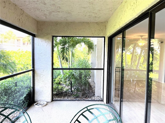 sunroom / solarium featuring a healthy amount of sunlight