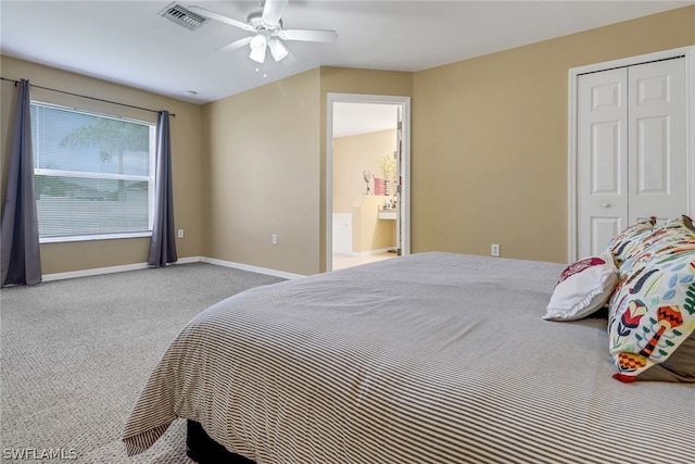 bedroom featuring ceiling fan, a closet, and carpet floors