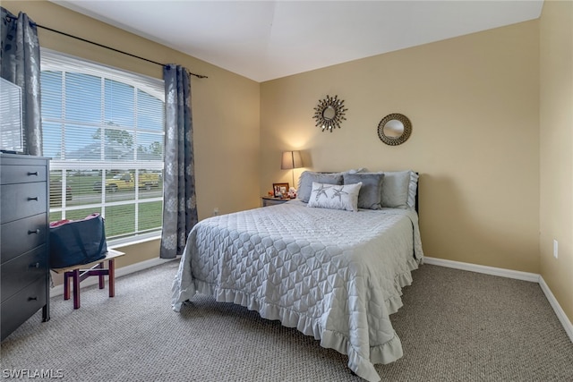 bedroom with light colored carpet