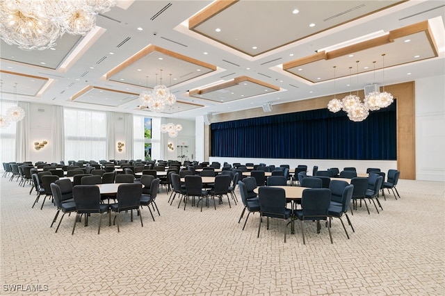 carpeted dining space with coffered ceiling and an inviting chandelier