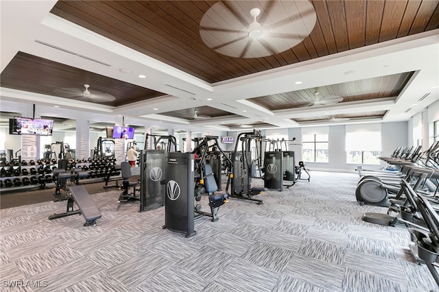 workout area featuring ceiling fan, light colored carpet, a raised ceiling, and wooden ceiling