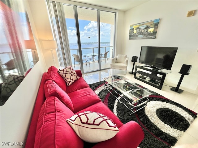 living room featuring a wall of windows and tile patterned flooring