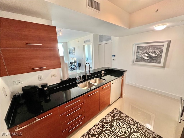 3000 Oasis Grand Blvd Unit 1606, Fort Myers, FL 33916 - kitchen featuring visible vents, dark countertops, white dishwasher, modern cabinets, and a sink