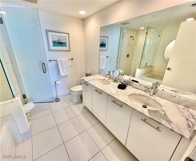 bathroom with tile patterned floors, dual bowl vanity, and toilet