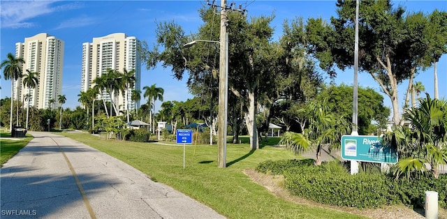 view of home's community with a yard