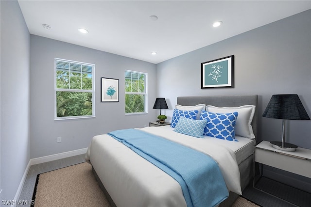 bedroom with carpet floors, recessed lighting, and baseboards