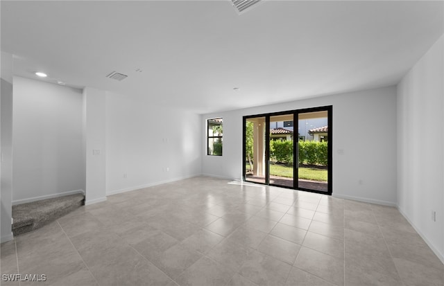 spare room with light tile patterned floors