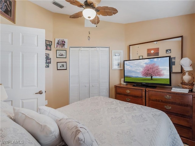 bedroom featuring ceiling fan and a closet