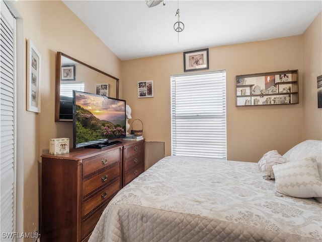 bedroom featuring vaulted ceiling