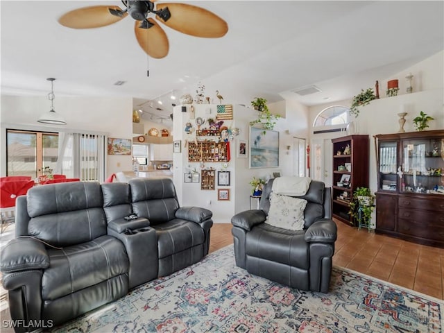 tiled living room featuring ceiling fan