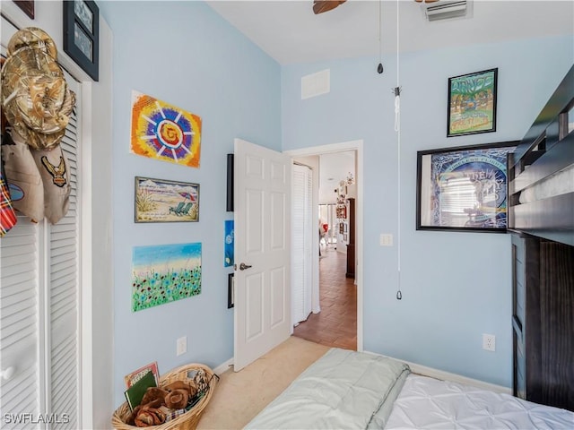 bedroom with ceiling fan and light parquet flooring