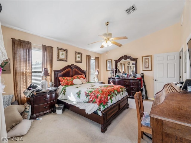 bedroom with ceiling fan and light carpet