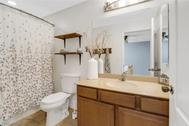 bathroom with vanity, toilet, tile patterned floors, and ceiling fan