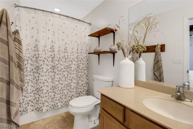 bathroom with toilet and vanity