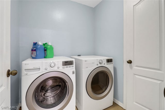 washroom with washer and clothes dryer