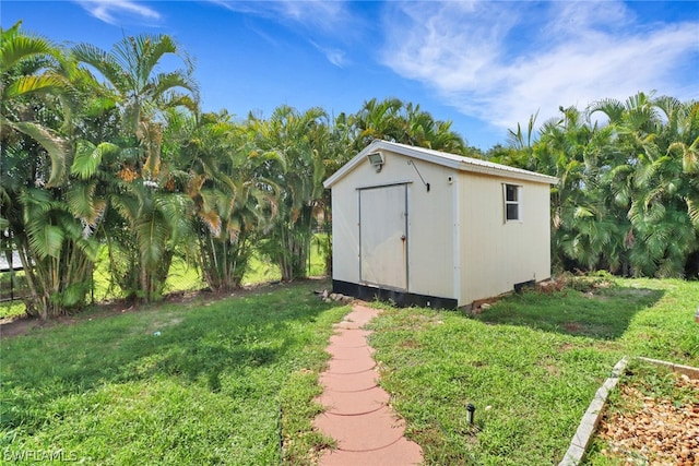 view of outdoor structure with a lawn