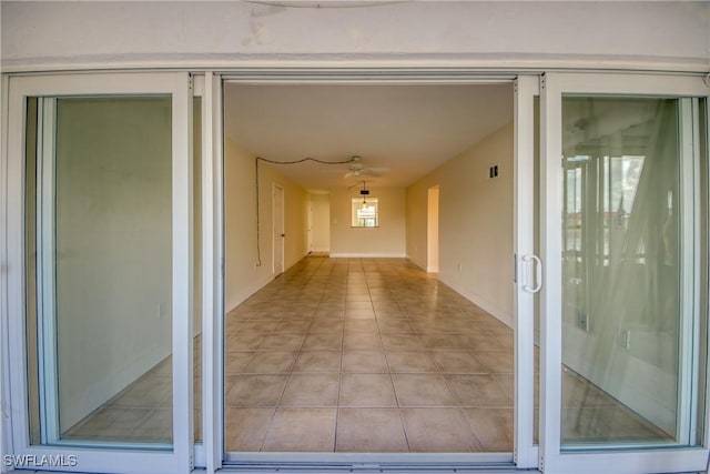 entrance to property featuring a patio area