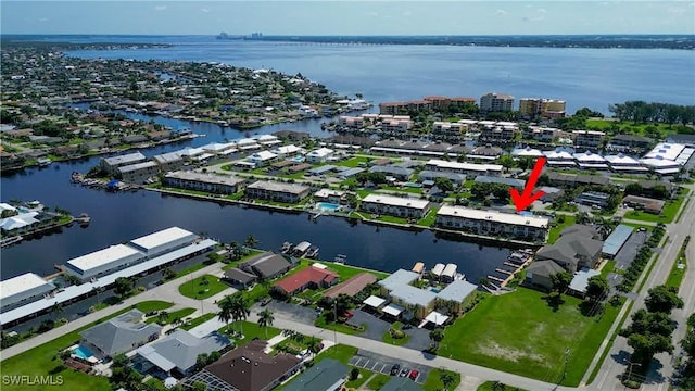 birds eye view of property featuring a water view