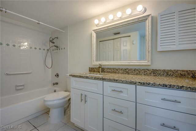 full bathroom with shower / bathing tub combination, vanity, toilet, and tile patterned flooring