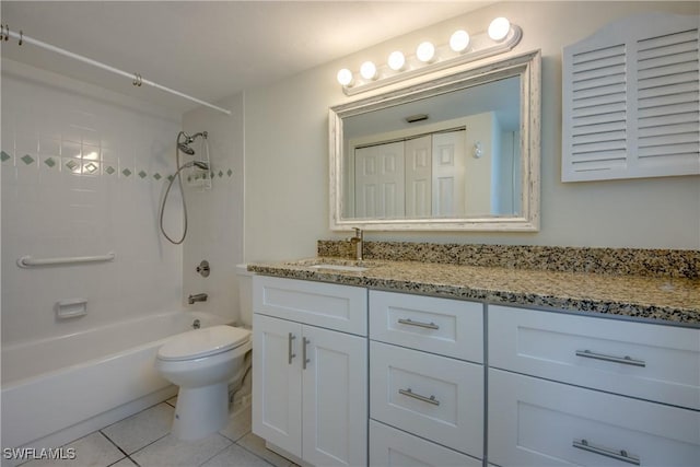 full bathroom featuring vanity, tile patterned floors, toilet, and washtub / shower combination