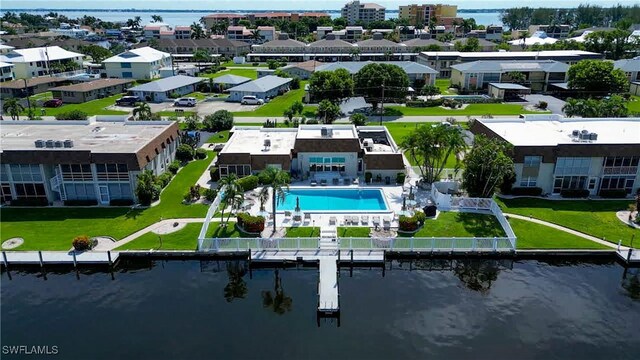 birds eye view of property with a water view