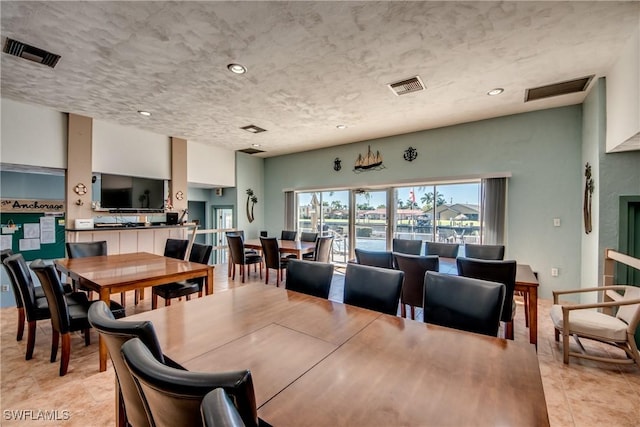 dining room with a textured ceiling