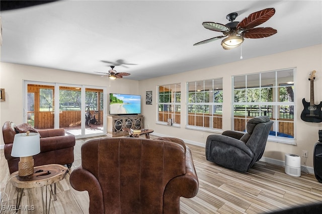 15700 Bahama Way, Bokeelia, FL 33922 - living room with ceiling fan, baseboards, and wood finished floors