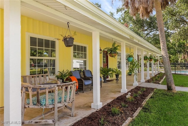 15700 Bahama Way, Bokeelia, FL 33922 - view of patio / terrace featuring covered porch and fence