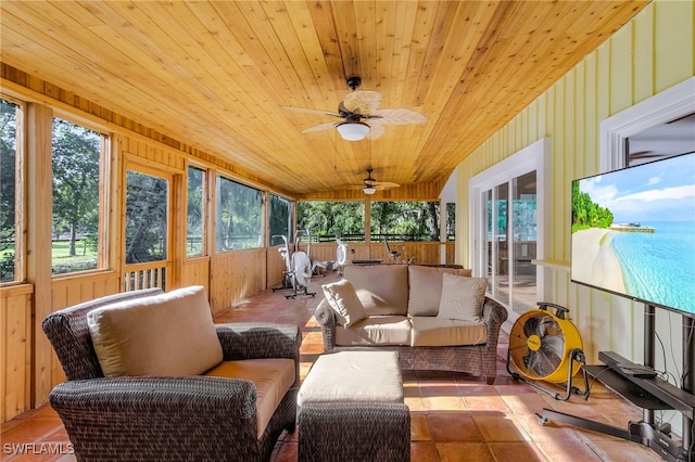 sunroom / solarium with plenty of natural light, wooden ceiling, and ceiling fan