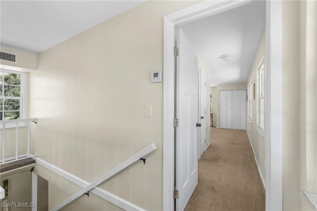 15700 Bahama Way, Bokeelia, FL 33922 - hallway featuring carpet and baseboards