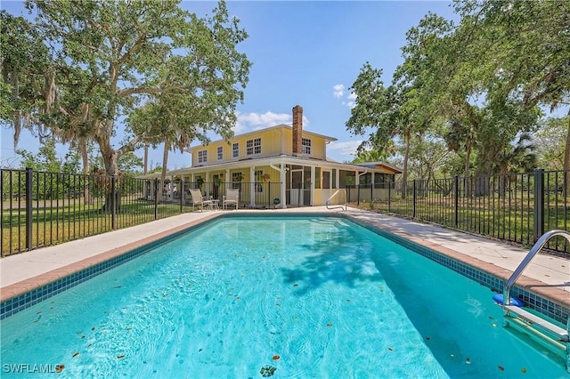 15700 Bahama Way, Bokeelia, FL 33922 - view of swimming pool featuring a sunroom and fence