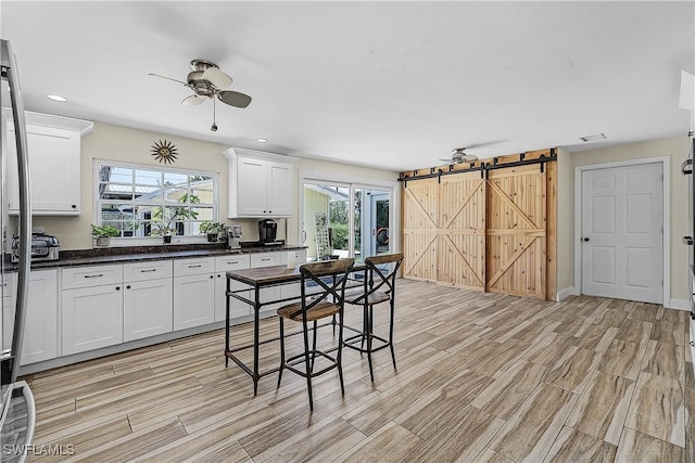 15700 Bahama Way, Bokeelia, FL 33922 - kitchen with light wood-type flooring, a ceiling fan, healthy amount of natural light, and recessed lighting