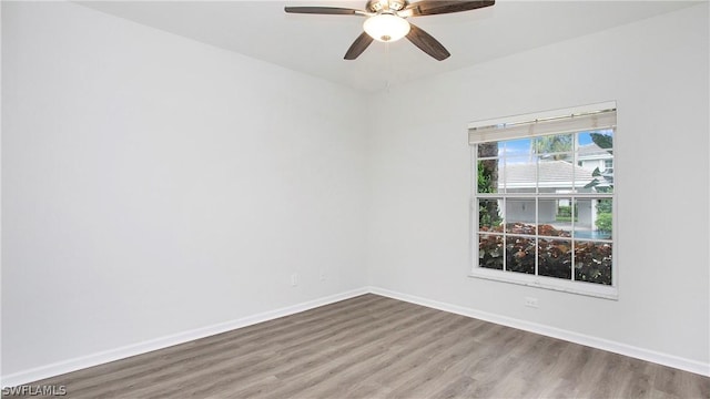 spare room featuring ceiling fan and wood-type flooring