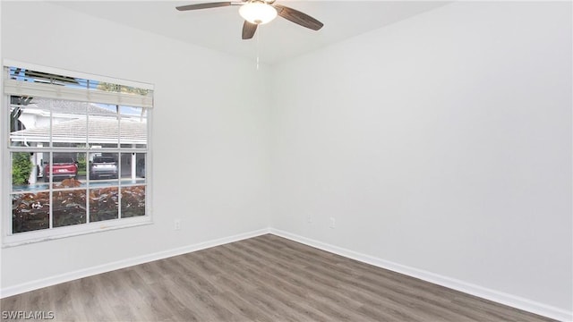 spare room with ceiling fan and hardwood / wood-style floors