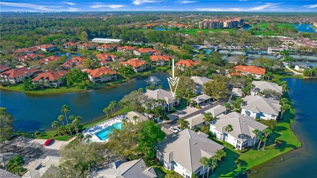 birds eye view of property with a water view