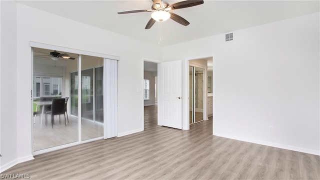 unfurnished room with wood-type flooring and ceiling fan