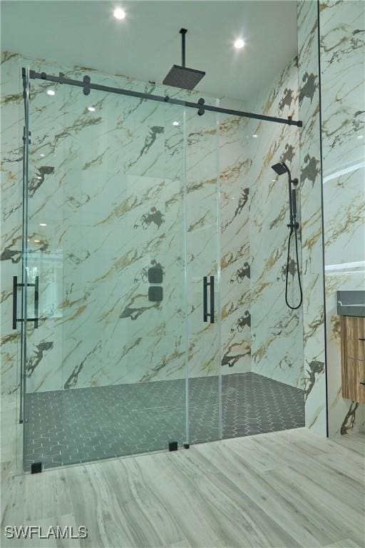 full bath with a marble finish shower