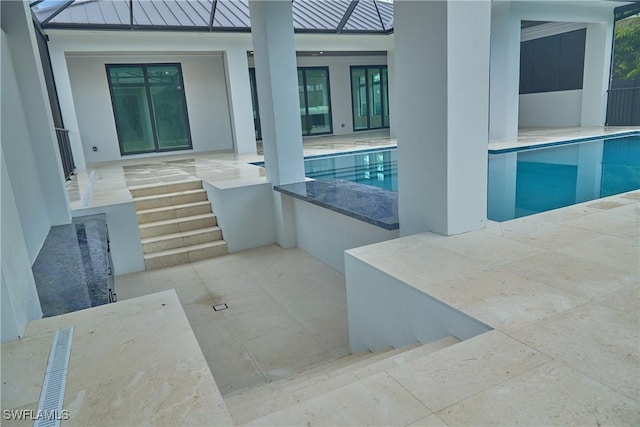 pool featuring a patio area