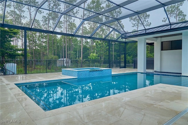 view of swimming pool with a lanai, a patio area, and a pool with connected hot tub