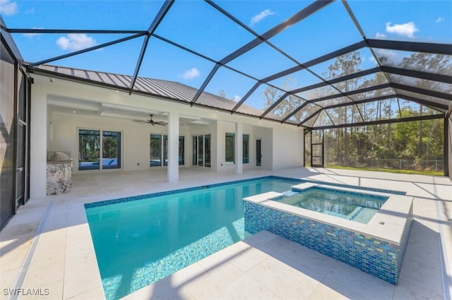 view of pool featuring an in ground hot tub, a patio area, ceiling fan, and a lanai