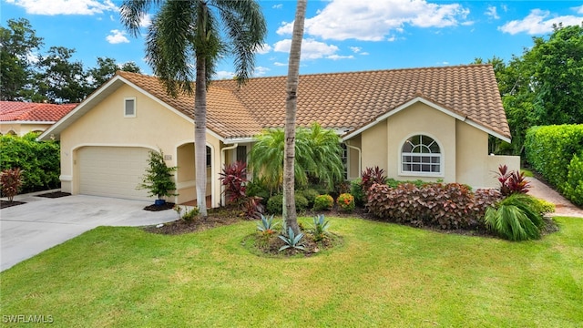 mediterranean / spanish house featuring a garage and a front lawn