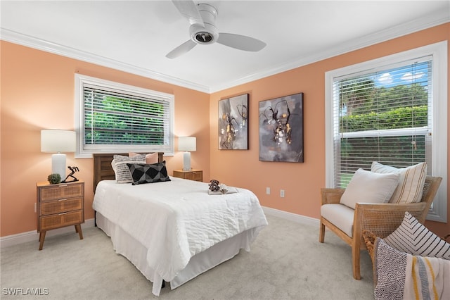 carpeted bedroom with multiple windows, ornamental molding, and ceiling fan