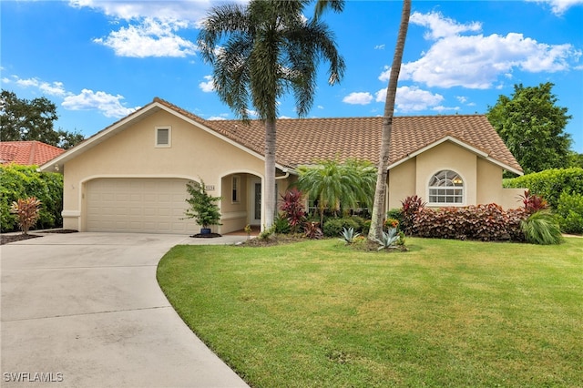 view of front of house with a garage and a front yard