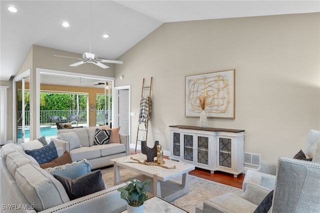 living room with vaulted ceiling and hardwood / wood-style floors