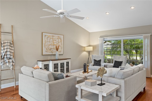 living room with lofted ceiling, dark hardwood / wood-style floors, and ceiling fan