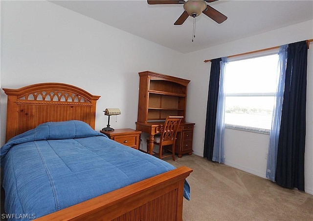 bedroom with light colored carpet and ceiling fan