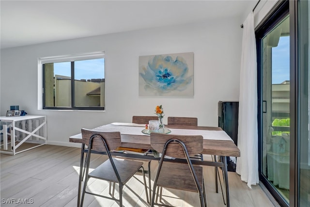 dining area with light wood-type flooring