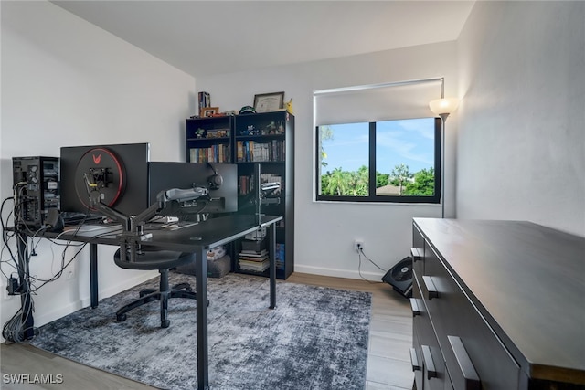 office area with light hardwood / wood-style flooring