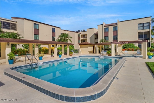 view of pool featuring a patio