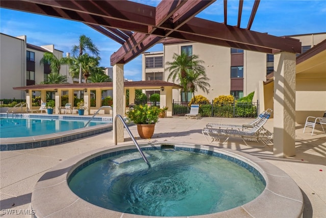 view of pool with a pergola, a patio, and a community hot tub